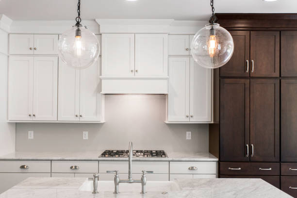 istock Modern Kitchen With White Cabinets, Pendant Lights, And Marble Countertops. 2163515099