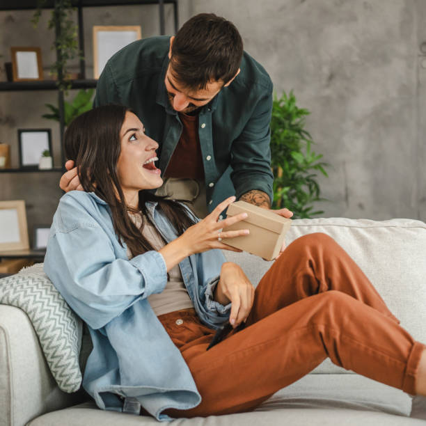 istock Boyfriend surprise his girlfriend for birthday with gift present 2163517632