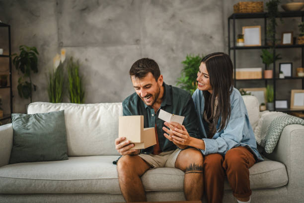 istock Boyfriend read greeting card thank you note from his girlfriend 2163517681