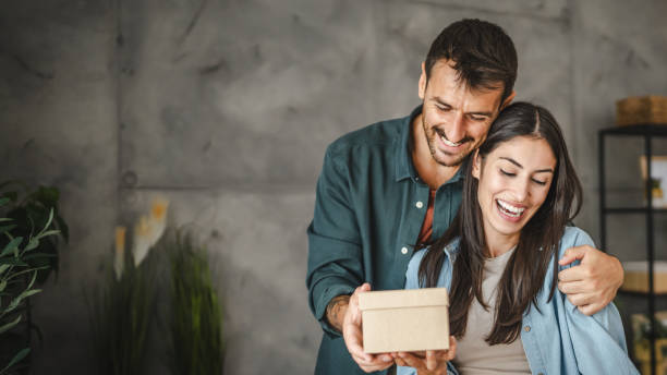 istock Boyfriend surprise his girlfriend for birthday with gift present 2163517858
