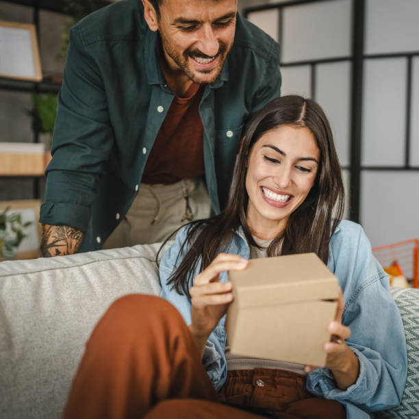 istock Boyfriend surprise his girlfriend for birthday with gift present 2163518041