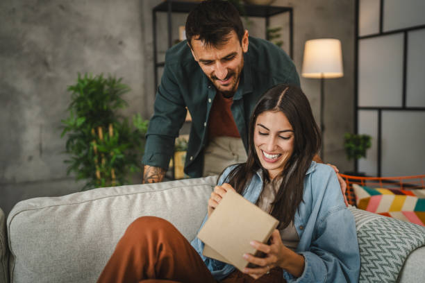 istock Boyfriend surprise his girlfriend for birthday with gift present 2163518069