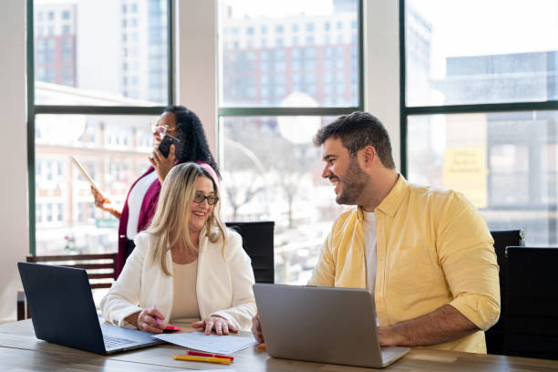 istock Small group of people working at the office 2163520341