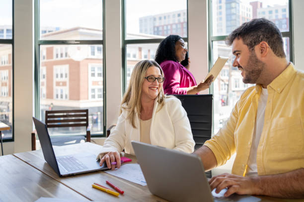 istock Small group of people working at the office 2163521135