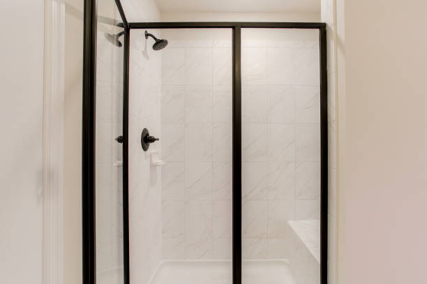 istock Modern Glass Shower Enclosure With Black Framing And Marble Tile Walls. 2163522563
