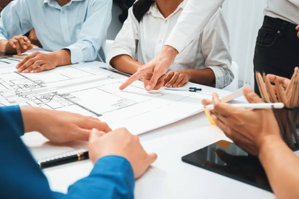 istock Diverse group of civil engineer and client working on architect. Prudent 2163522739