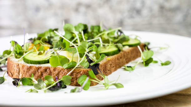 istock Open faced sandwich with microgreens and cucumber 2163523040