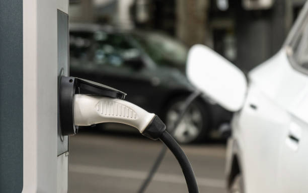 istock Charging an electric vehicle with a power cable 2163523310