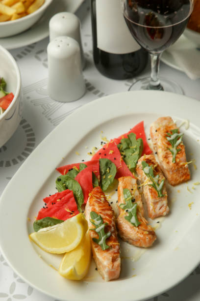 istock Grilled Salmon fillet with marinated vegetables served on the restaurant table 2163524313