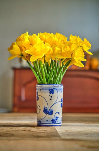 A bouquet of flowers on a dinning table in the livingroom