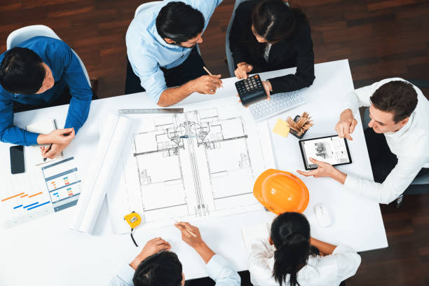 istock Diverse group of civil engineer and client working on architect. Prudent 2163525884