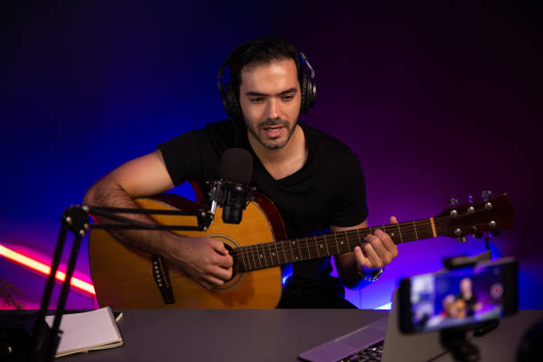 istock Influencer creative audio on live streaming with sing with play guitar. Surmise. 2163527946