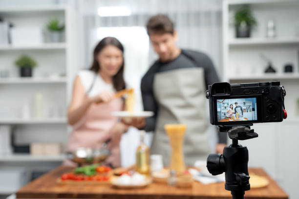 istock Chef influencers cooking special spaghetti with tongs to fried pan. Postulate. 2163528163