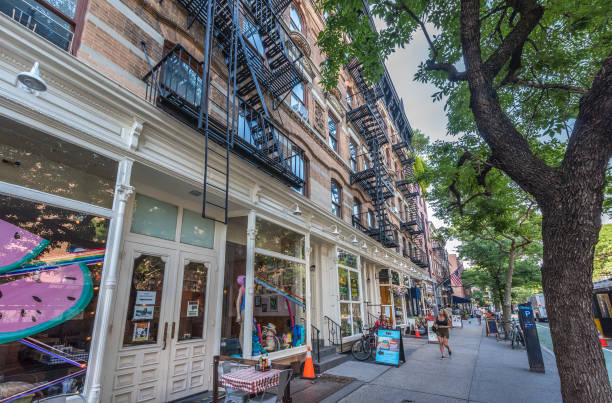 New York City, NY, USA - July 8, 2024: Quiet moments in the afternoon in front of several small businesses. Small, elegant and charming businesses are spread throughout the streets of Manhattan, New York, offering exclusive and high-quality services.