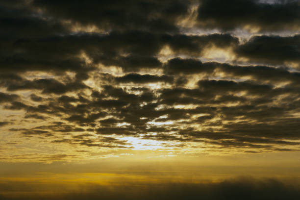 Dramatic stormy dark cloudy sky with fog.