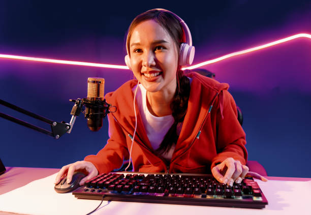 istock Host channel smiling Asian wearing headphone recording on phone. Stratagem. 2163528794