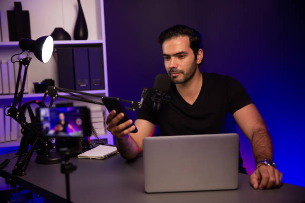 istock Broadcaster talking to listener on live streaming with blurred screen. Surmise. 2163529033