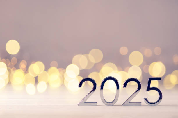 istock Metal numbers 2025 on table with bokeh lights. 2163529432