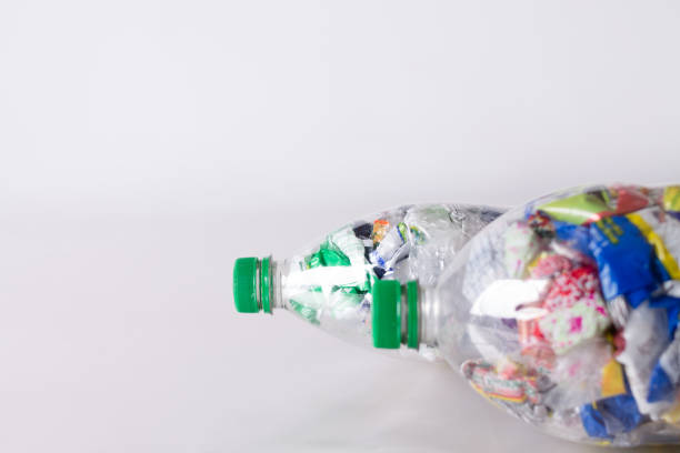 istock Ecobrick, clear plastic bottles filled and compacted with plastic waste 2163533101