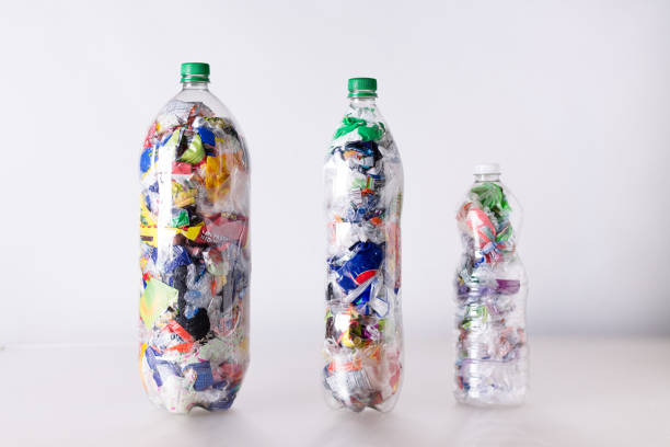 istock Ecobrick, clear plastic bottles filled and compacted with plastic waste 2163533103