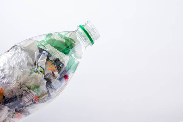 Plastic garbage on a plate, concept of junk unhealthy food