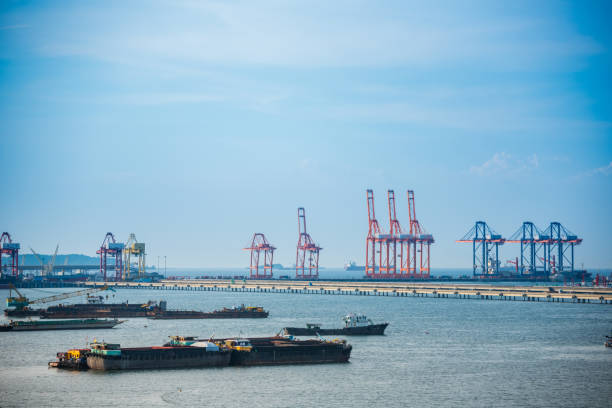 istock Logistic shipping quay boat Engineering crane depot at logistic export terminal control. Warehouse freight background container yard loading quayside harbor port. Logistics seascape shipping portal 2163533632