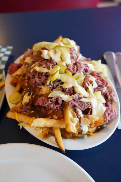 istock Canadian food - poutine with Montreal smoked meat 2163535494