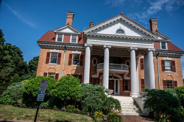 Facade of big old brick wall house in Portsmouth during summer day