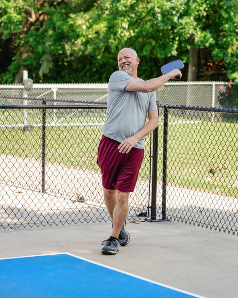 istock Senior man playing pickleball 2163538342