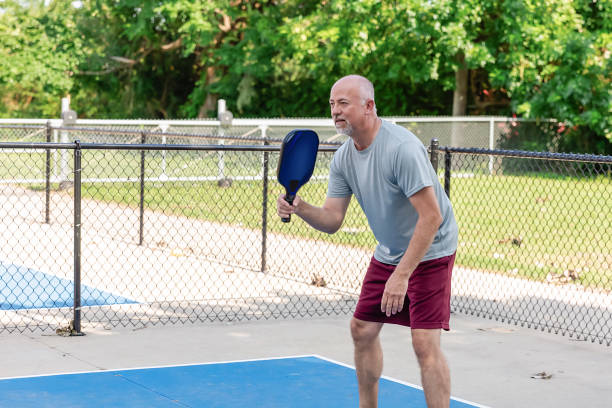 istock Senior man playing pickleball 2163538359