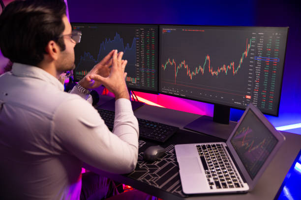 istock Smart trader concentrating on dynamic stock exchange on pc and laptop. Surmise. 2163541000