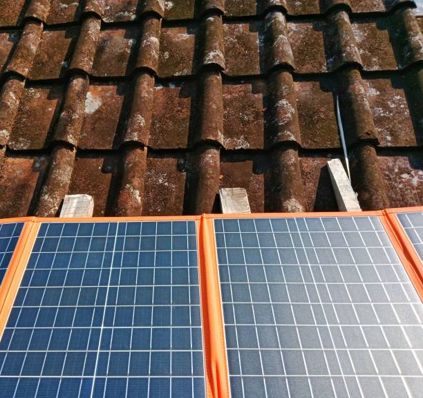 istock Portable solar panels on tile roofs to generate electrical energy 2163541908