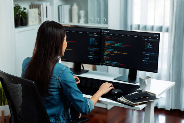 istock Young Asian in IT creating with typing online information on pc. Stratagem. 2163542856