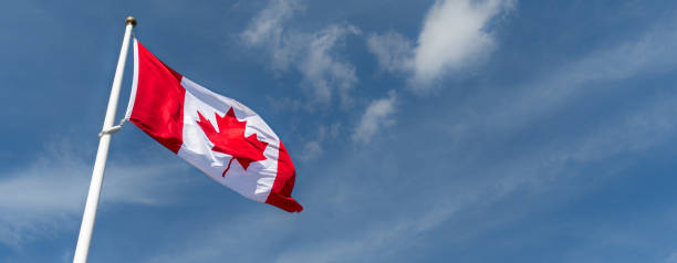 istock Canada Flag Waving in the Wind on a Flagpole 2163544187