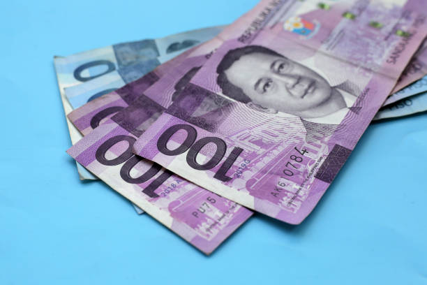 istock Philippine money, Banknotes on blue background. 2163545329
