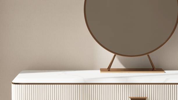 istock Modern, minimal white dressing table, gold steel frame round vanity mirror in sunlight on beige white wallpaper wall bedroom 2163545483