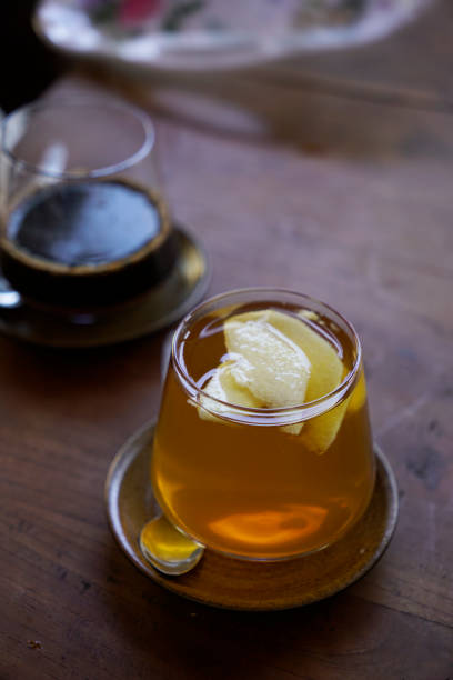 istock A glads of ginger honey tea with apple garnish on top 2163547068