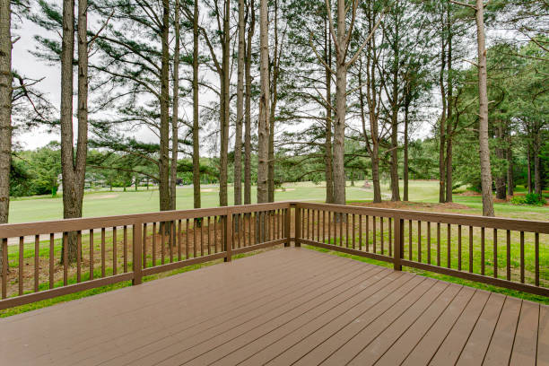 istock Spacious Wooden Deck Overlooking A Serene Pine Forest And Clear Sky. 2163547596