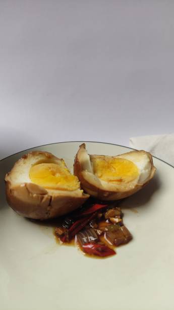 istock Eggs marinated in soy sauce, garlic and chili on a white background 2163547682