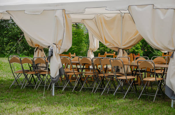 istock Summer tent with chairs stacked outside for celebration 2163548277