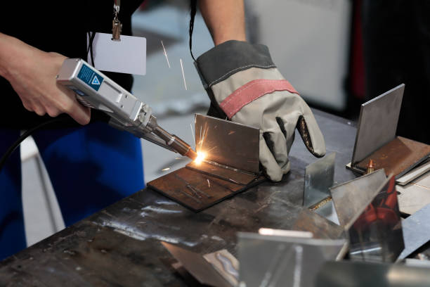 istock young female welder working 2163548640