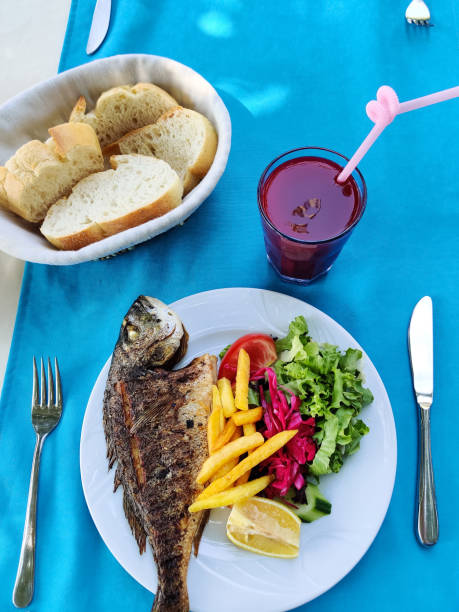 delicious and fresh dish with baked fish top view