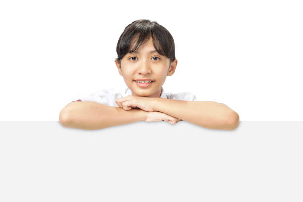 istock A girl is looking through a white board 2163549900
