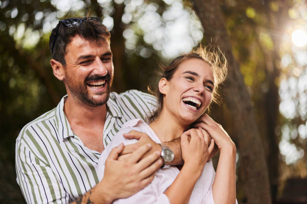 istock Cheerful embraced couple enjoying in the park. 2163549962
