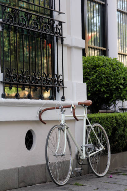 istock White retro road bicycle in front of white wall 2163551283