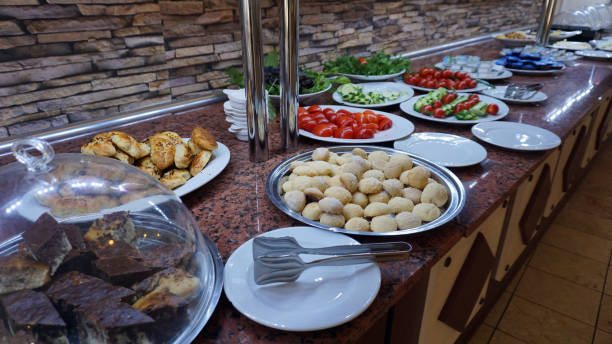 istock Tomatoes, cucumbers, cheese, pastries and olives prepared at the open buffet for breakfast 2163552215