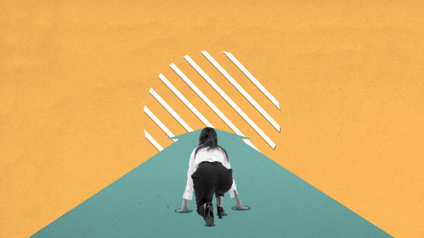 istock A woman is crouching down and looking up at a wall 2163552412