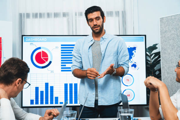 istock Analyst team utilizing BI Fintech to analyze financial data at table. Prudent 2163552418