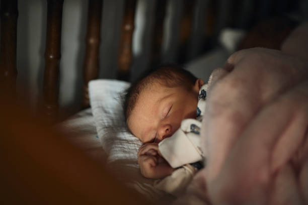 istock Sleeping newborn baby girl 2163552706