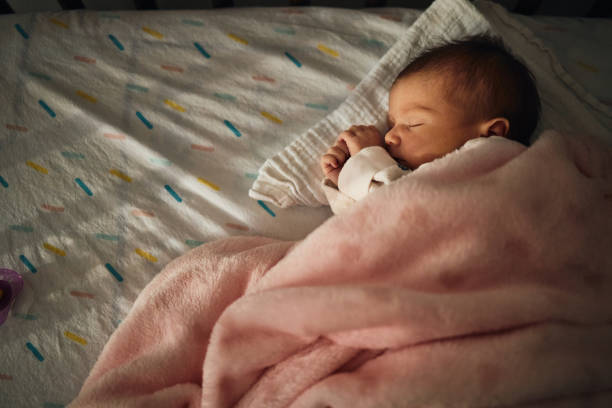istock Sleeping newborn baby girl 2163552715